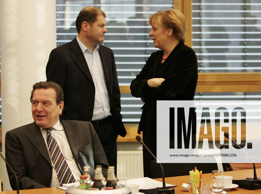 Nov 10, 2005 - Berlin, GERMANY - After the inconclusive result of the 2005 German federal election, neither of the traditional coalitions could form a majority government and so the formation of a new government required careful negotiations. Finally, on October 10, officials from the CDU CSU and the SPD announced that negotiations had concluded successfully on forming a Grand Coalition with Angela Merkel as a Chancellor. Detailed negotiations on the formation of the new government continued into November. PICTURED: Chancellor GERHARD SCHROEDER, SPD politician OLAF SCHOLZ and Designated Chancellor and CDU CSU Chairwoman ANGELA MERKEL. - ZUMAkg1_ 20051110_olc_k98_815