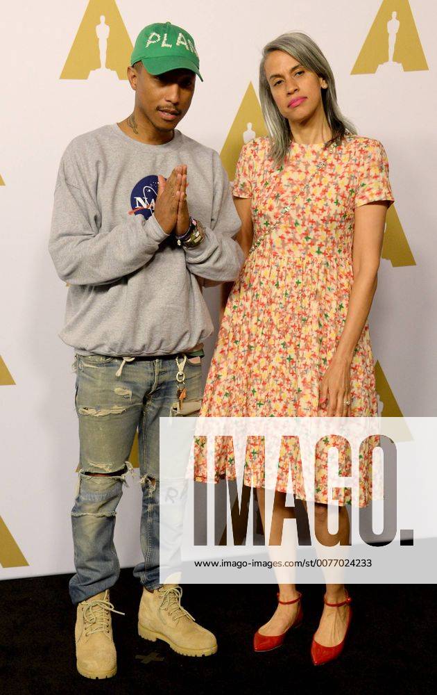 Producer Pharell Williams (L) and Mimi Valdes attend the 89th annual Academy Awards Oscar nominees luncheon at the Beverly Hilton Hotel in Beverly Hills, California on February 6, 2017. LAP20170206145 JIMxRUYMEN