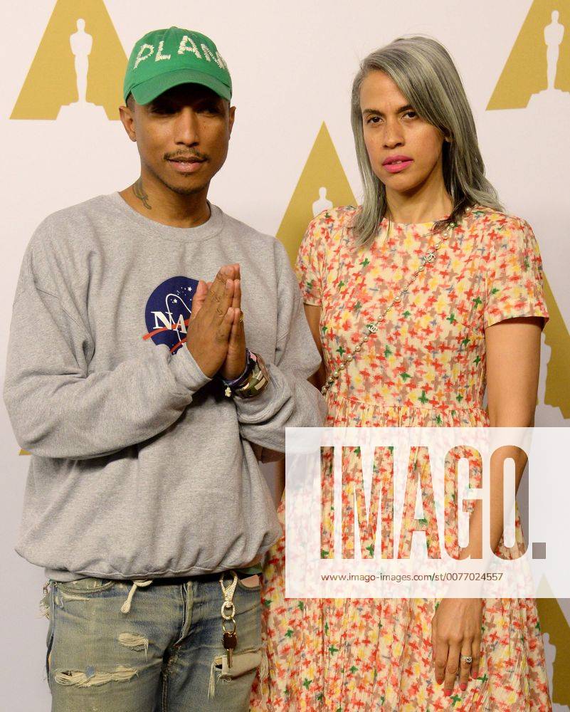 Producer Pharell Williams (L) and Mimi Valdes attend the 89th annual Academy Awards Oscar nominees luncheon at the Beverly Hilton Hotel in Beverly Hills, California on February 6, 2017. LAP20170206147 JIMxRUYMEN