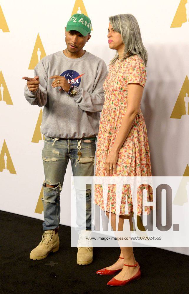 Producer Pharell Williams (L) and Mimi Valdes attend the 89th annual Academy Awards Oscar nominees luncheon at the Beverly Hilton Hotel in Beverly Hills, California on February 6, 2017. LAP20170206148 JIMxRUYMEN