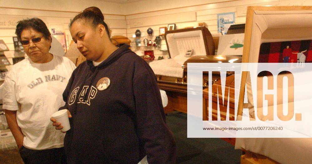 U.S. - KRT US NEWS STORY SLUGGED: SCHOOLSHOOTING BY JOHN DOMAN ST. PAUL PIONEER PRESS (March 23) BEMIDJI, MN -- Theresa Spike, 31, and her mother, Alberta Spike, 64, examine coffins at Cease Family Funeral Home in Bemidji, Minnesota, on Wednesday, March 23, 2005. Theresa s daughter, Alicia White, 14, was killed in the shooting spree at Red Lake High School on Monday, March 21, 2005. (mvw) 2005 (Diversity) - ZUMAm67_ 20050323_baf_m67_022
