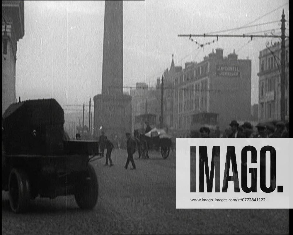 Crowds Parting and Being Held Back by Soldiers for Armoured Cars to Pass Through the Streets in Dublin, 1920. In Dublin s fair city, armoured cars were used to break up hostile and unruly mobs of demonstrators. It might have been effective, and no doubt it gave the drivers a sense of power, but in truth, it was really no way to rule a fair city . From Time To Remember - The Plunge Into Peace, 1920 (Reel 4); events of 1920 - weddings, women s rights, industrial unrest and problems in Ireland
