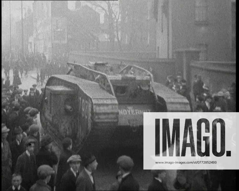 A Tank Breaking up Crowds of Demonstrators in Dublin, 1920. Outside Dublin s Mountjoy Prison, holding so many of their friends, angry crowds showed the spirit of their city by demonstrations that only heavy armour could break up. But could that spirit really be broken up? Whoever was arrested, there was always someone fresh to hold up the flag of Irish independence. Always someone a-wearing of the green . From Time To Remember - The Plunge Into Peace, 1920 (Reel 4); events of 1920 - weddings, women s rights, industrial unrest and problems in Ireland