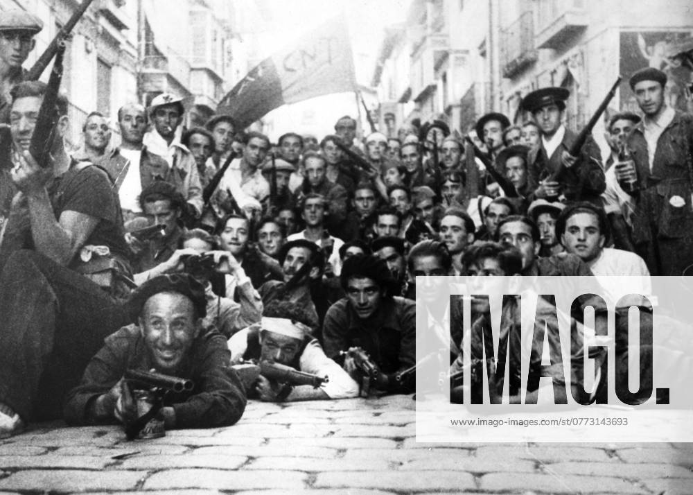 Orig caption THE CIVIL WAR IN SPAIN Communists and Anarchists in the streets of Tolede under the red and black flag Note Spanish Civil War armed conflict between right wing