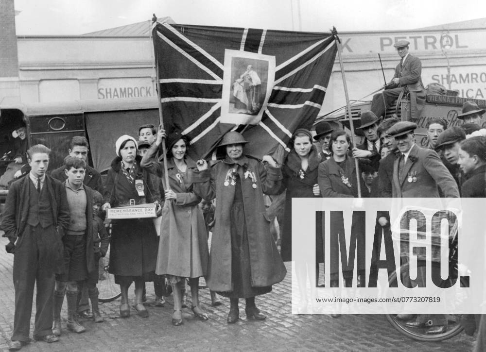 Orig. caption... POPPY RIOTS IN DUBLIN. Riotous scenes occurred in Dublin following Armistice Day celebrations. Police made baton charges against a mob of 2000 youths who pounced upon people wearing poppies and tore them from their coats. A group of participants in the celebrations who carried the Union Jack were attacked, and after the police had cleared things the Union Jack was confiscated. Photo shows:- The Union Jack which was afterwards confiscated by the police as it is contrary to orders to carry it in the Free State, and some of the participants who carried it and were attacked. November 12th 1932 Note. Armistice Day was celebrated on November 11 in the years 1919-1938 in memory of those who fell in the First World War. Hand in poc