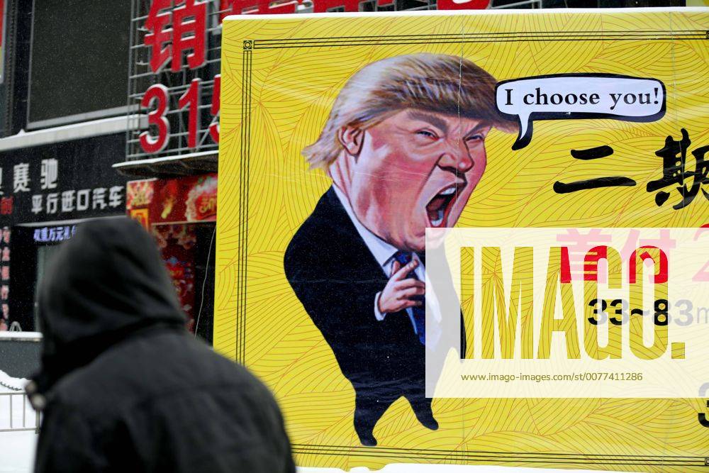 Shenyang, Shenyang, China - Shenyang, CHINA-February 22 2017: (. CHINA OUT) ..The cartoon portrait of American president Donald Trump can be seen on an advertisement board of real estate company in Shenyang, northeast China s Liaoning Province, February 22nd, 2017. The advertisement, which might violate the portrait rights of Donald Trump, attracts attention of many passers-by. Shenyang China - ZUMAs145 20170222_zaa_s145_093