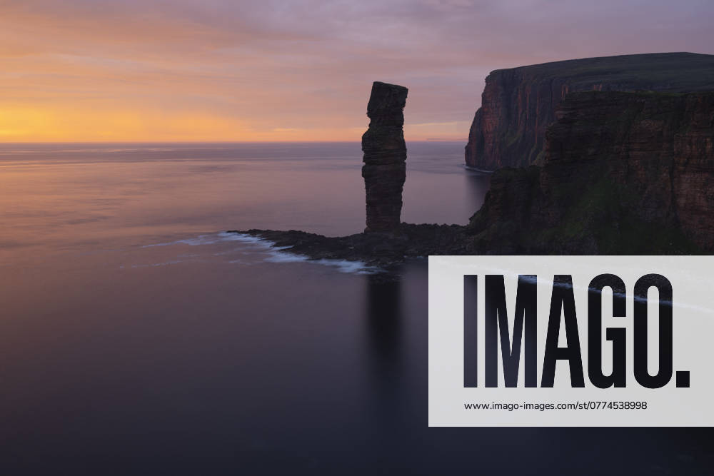 Sunset overlooking Old Man of Hoy sea stack, Hoy, Orkney, Scotland Rackwick, Scotland, United Kingdom R_XCPU241018-1563768-01