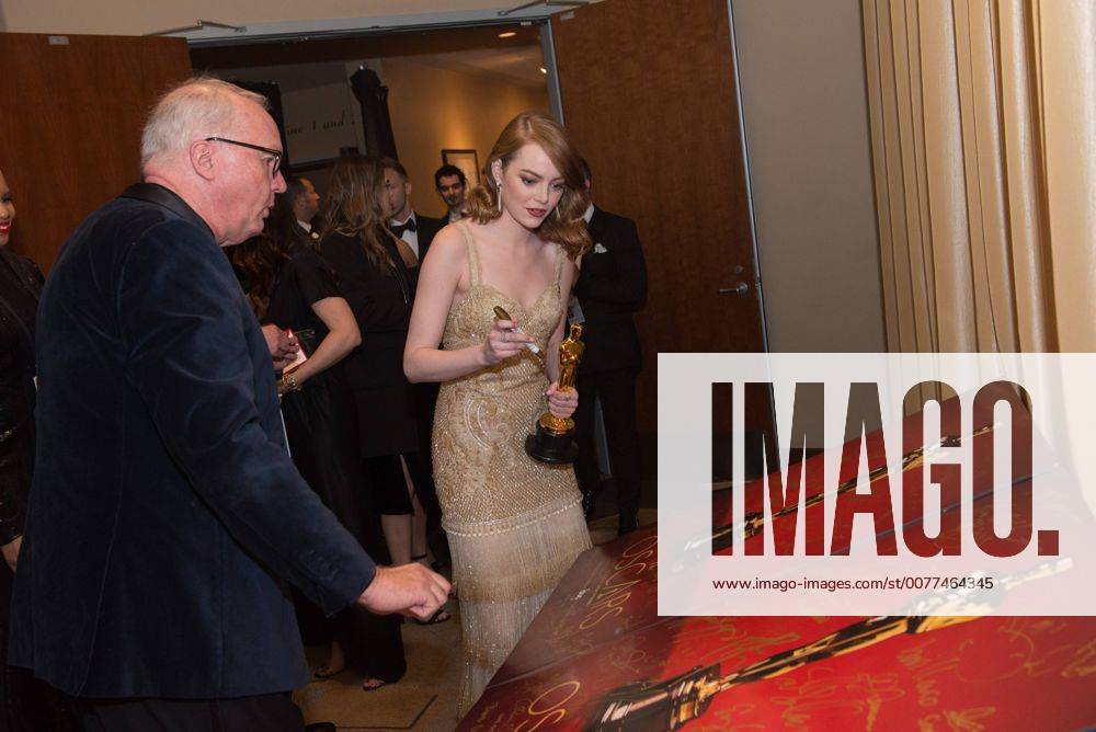 Feb 26, 2017 - Hollywood, California, U.S - EMMA STONE, Oscar winner for Best Performance by an actress in a Leading role, signs an official Oscars poster backstage The 89th Oscars at the Dolby Theatre in Hollywood, CA on Sunday, February 26, 2017. Hollywood U.S. - ZUMAz03_ 20170226_sho_z03_632