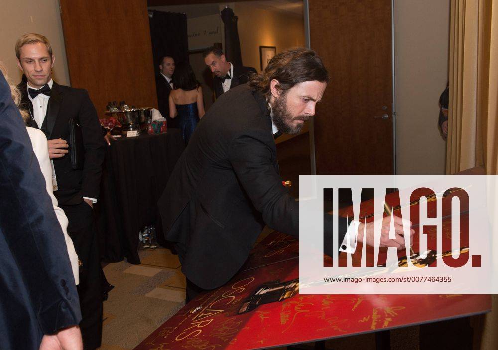 Feb 26, 2017 - Hollywood, California, U.S - CASEY AFFLECK, Oscar winner for Best Performance by an actor in a Leading role, signs an official Oscars poster backstage The 89th Oscars at the Dolby Theatre in Hollywood, CA on Sunday, February 26, 2017. Hollywood U.S. - ZUMAz03_ 20170226_sho_z03_631