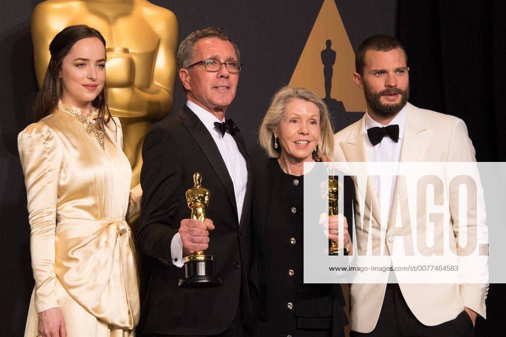 Feb 26, 2017 - Hollywood, California, U.S - David Wasco for Production Design and Sandy Reynolds-Wasco for Set Decoration pose backstage with the Oscar for Achievement in production design, for work on La La Landâ with presenters Dakota Johnson Jamie Dornan during the live ABC Telecast of The 89th Oscars at the Dolby Theatre in Hollywood, CA on Sunday, February 26, 2017. Hollywood U.S. - ZUMAz03_ 20170226_sho_z03_587