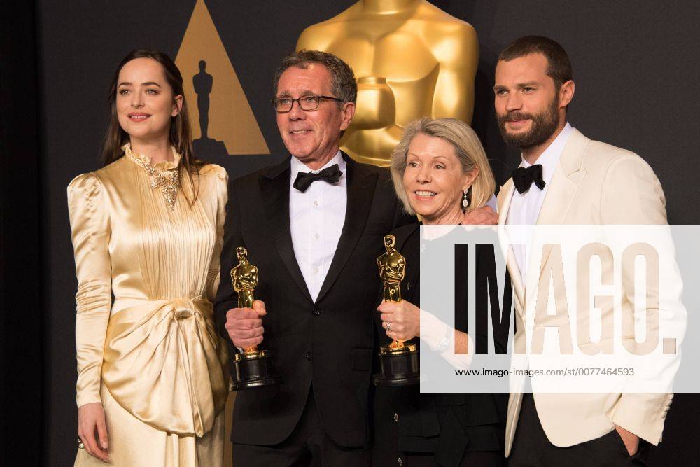 Feb 26, 2017 - Hollywood, California, U.S - David Wasco for Production Design and Sandy Reynolds-Wasco for Set Decoration pose backstage with the Oscar for Achievement in production design, for work on La La Landâ with presenters Dakota Johnson Jamie Dornan during the live ABC Telecast of The 89th Oscars at the Dolby Theatre in Hollywood, CA on Sunday, February 26, 2017. Hollywood U.S. - ZUMAz03_ 20170226_sho_z03_585