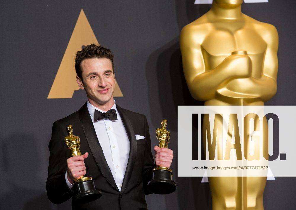 Justin Hurwitz poses after winning the Best Original Score award and the Best Original Song award for La La Land at press room of the 89th Academy Awards at the Dolby Theater in Los Angeles, the United States, on Feb. 26, 2017. )(zf) U.S.-LOS ANGELES-OSCAR-AWARD YangxLei