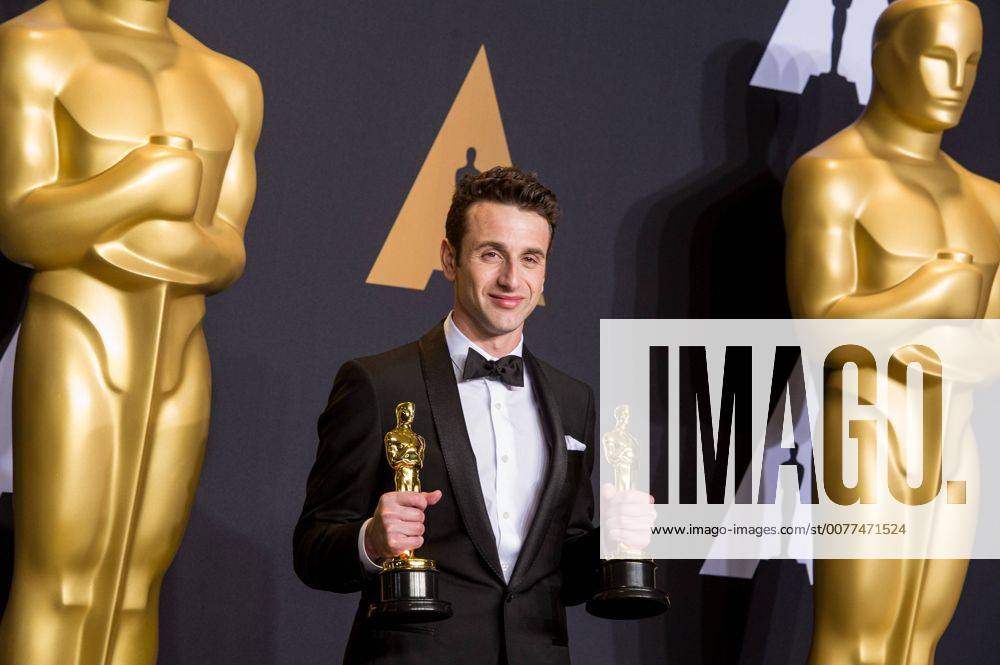 Justin Hurwitz poses after winning the Best Original Score award and the Best Original Song award for La La Land at press room of the 89th Academy Awards at the Dolby Theater in Los Angeles, the United States, on Feb. 26, 2017. )(zf) U.S.-LOS ANGELES-OSCAR-AWARD YangxLei