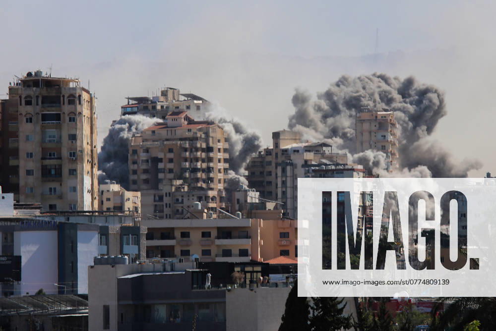Smoke rises above buildings from an Israeli airstrike that targeted Al-Hawsh village outside Tyre City, Lebanon on Tuesday, October 22, 2024. Thirteen people, including a child, have been killed and 57 people wounded in an Israeli strike near Rafik Hariri University Hospital in southern Beirut, Lebanon s Ministry of Public Health. LEB2024102203 NizarxKashmar