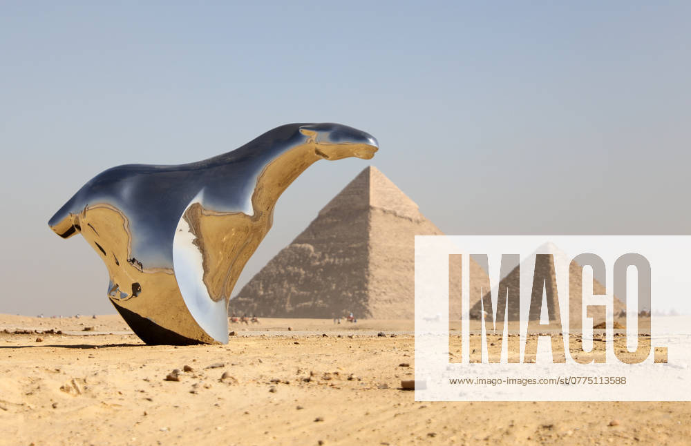 (241024) -- GIZA, Oct. 24, 2024 -- An artistic installation is displayed during the Forever Is Now international art exhibition at Giza Pyramids scenic spot in Giza, Egypt, Oct. 24, 2024. The fourth edition of Forever Is Now international art exhibition on Thursday kicked off in the area of Egypt s Giza Pyramids scenic spot, showcasing 12 artworks of artists from different countries. The exhibition runs from Oct. 24 to Nov. 16. ) EGYPT-GIZA-PYRAMIDS-ART EXHIBITION WangxDongzhen