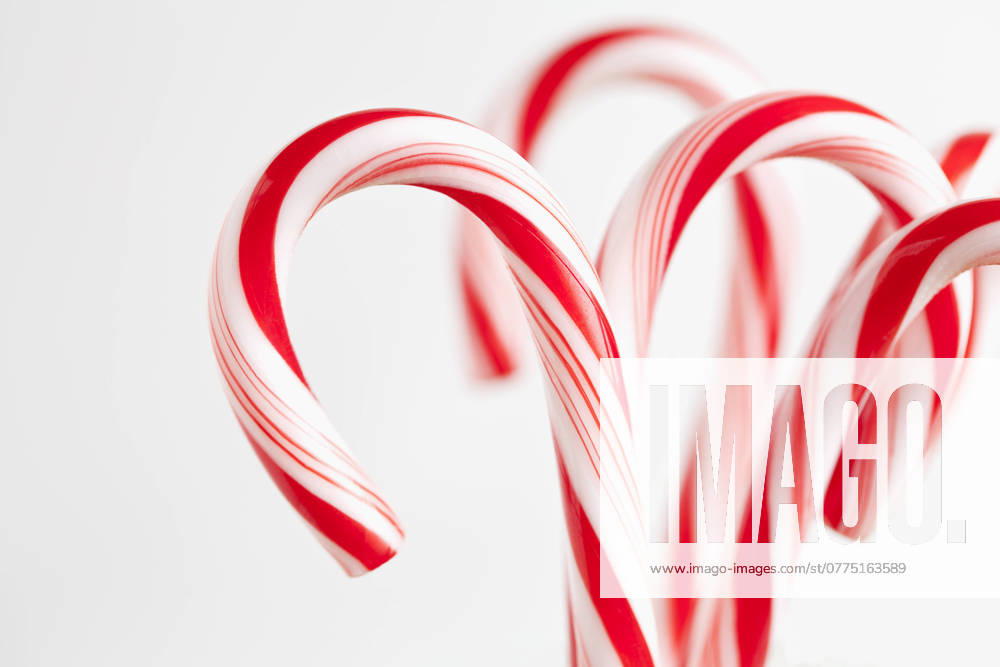 Red and white candy canes, studio shot , 03.10.2012, TTBB_ti2400128.jpg, Christmas, Candy Cane, Red, White, Striped, Backgrounds, Still Life, Food And Drink, Sweet Food, Three Objects, Horizontal, Vertical, Part Of, Focus On Foreground, Unhealthy Eating, No People, Studio Shot, White Background