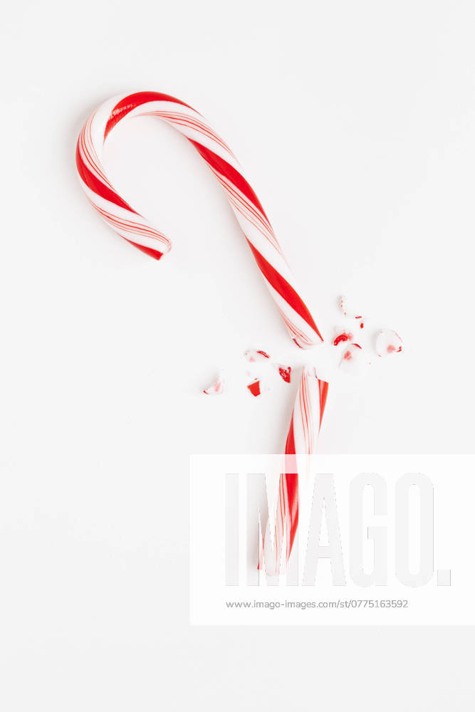 Red and white broken candy cane, studio shot , 03.10.2012, TTBB_ti2400129.jpg, Christmas, Candy Cane, Red, White, Broken, Copy Space, Still Life, Single Object, Food And Drink, Sweet Food, Striped, Vertical, Close-Up, Backgrounds, Elevated View, Part Of, Focus On Foreground, Unhealthy Eating, No People, Studio Shot, White Background, Full Length