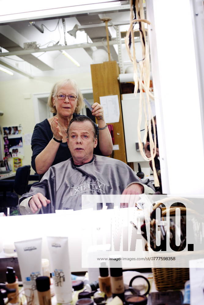 STOCKHOLM 20111202 Lena Strandmark, make-up artist and wig maker, applies organic make-up to actor Krister Henriksson in the make-up room at Dramaten STOCKHOLM SWEDEN