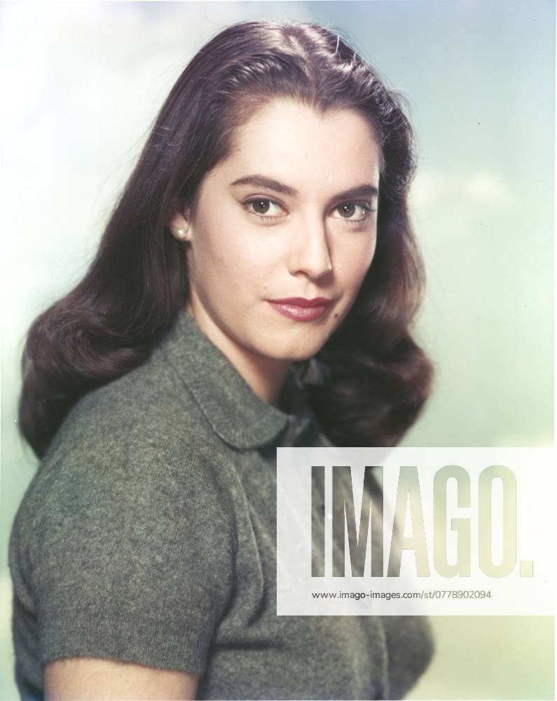 Susan Kohner wearing a Gray Blouse