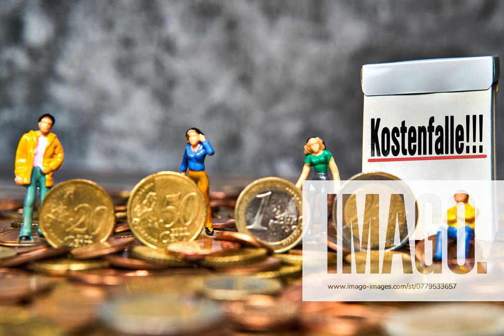 Cost trap is written on a sign, symbol for costs and rip-offs, spending trap for debts and payments that make a hole in your wallet. PHOTOMONTAGE