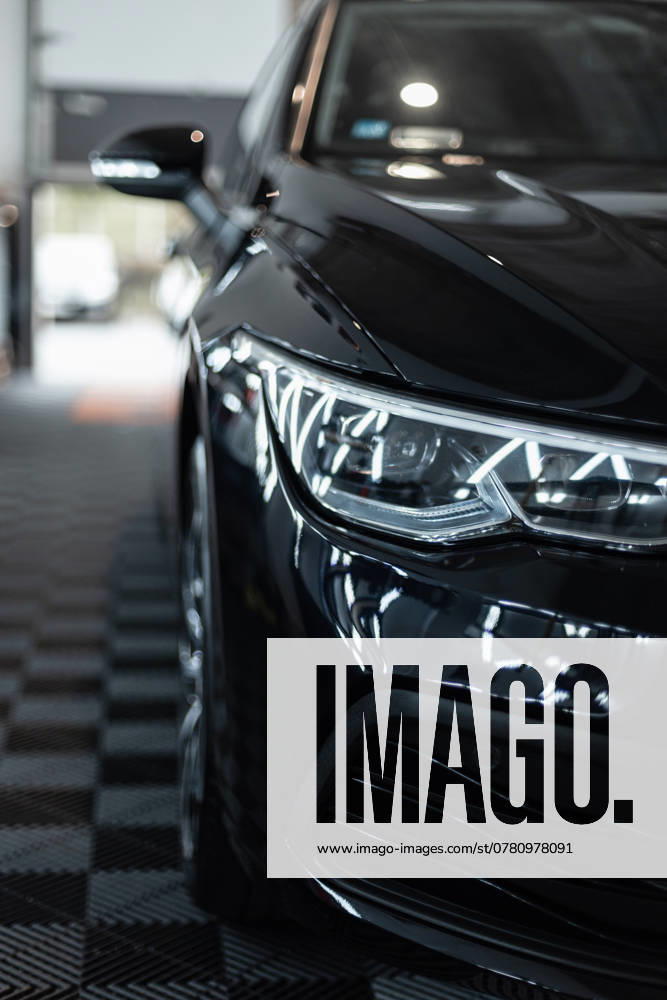 Black Car with optical Headlights is in the Garage Car wash Reconditioning Repair 1102821046