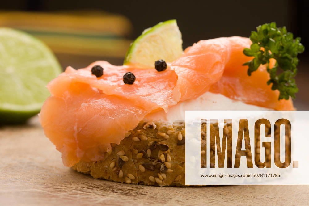 Photo of delicious crispy cereals bread with smoked salmon , 2186949.jpg, salmon, black pepper, lime, fish, smoked, bread, cereals, wheat, slice of cheese, creme fraiche, spreads, dairy products, cream, cream, onions, tomatoes, chopping parsley, food, eat light food, snacks, sandwiches, Canap�, hors d oeuvre, appetizer, crispy, RECORD DATE NOT STATED