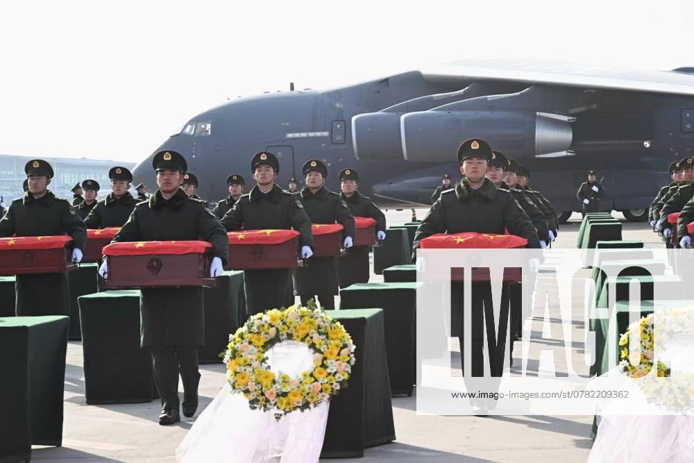 Chinese honor guards escort coffins containing remains of 43 Chinese People s Volunteers (CPV) martyrs at the Taoxian international airport on November 28, 2024 in Shenyang, Liaoning Province of China. The remains of 43 Chinese People s Volunteers (CPV) soldiers who lost their lives during the War to Resist U.S. Aggression and Aid Korea (1950-1953) were returned to China on Thursday from the Republic of Korea (ROK).