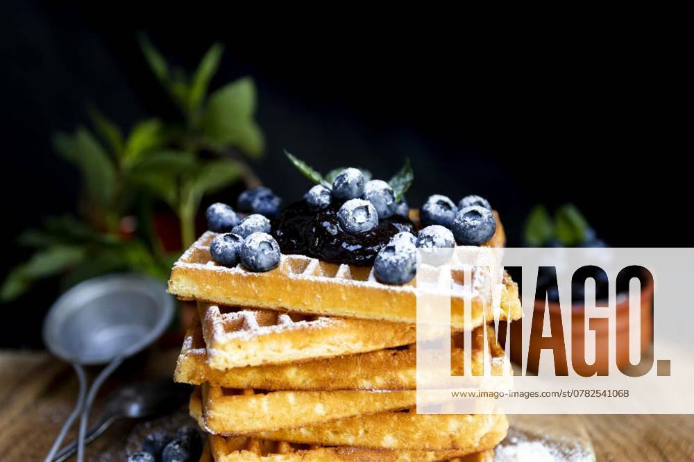 Waffles with fresh blueberries and powdered sugar on the rustic, Waffles with fresh blueberries and powdered sugar on the rustic table. Freshly baked Belgian waffles, Waffles with fresh blueberries and powdered sugar on the rustic table. Freshly baked Belgian waffles, 08.10.2024,