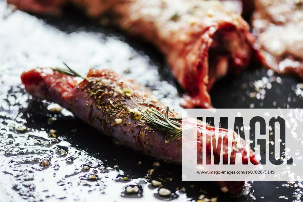 Lamb meat bbq preparation. Closeup of lamb chops with spices and, Lamb meat bbq preparation. Closeup of lamb chops with spices and rosemary on black rustic plate. Restaurant cuisine barbecue dish., Lamb meat bbq preparation. Closeup of lamb chops with spices and rosemary on black rustic plate. Restaurant cuisine barbecue dish., 20.10.2024,