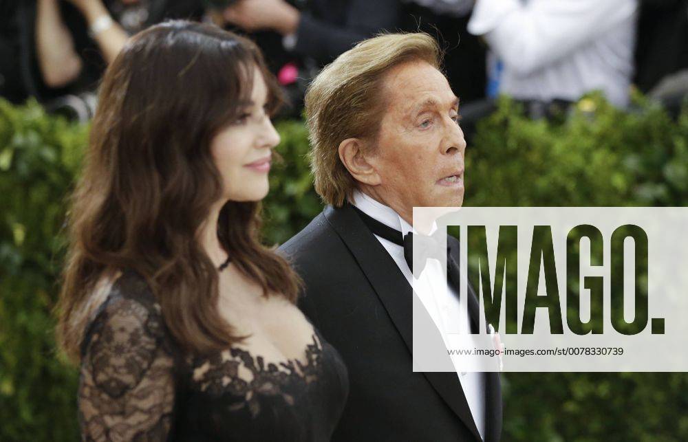 Monica Bellucci and Valentino Garavani arrive on the red carpet at the Costume Institute Benefit at The Metropolitan Museum of Art celebrating the opening of Rei Kawakubo Comme des Garcons: Art of the In-Between in New York City on May 1, 2017. NYP20170501612 JOHNxANGELILLO