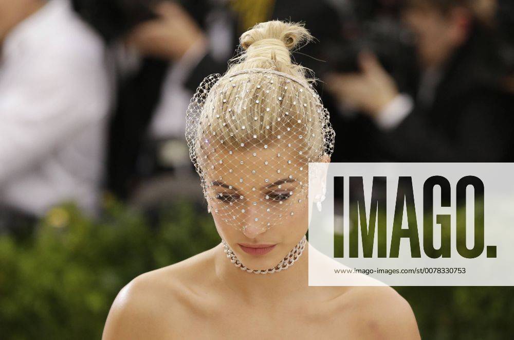 Hailey Baldwin arrives on the red carpet at the Costume Institute Benefit at The Metropolitan Museum of Art celebrating the opening of Rei Kawakubo Comme des Garcons: Art of the In-Between in New York City on May 1, 2017. NYP20170501605 JOHNxANGELILLO