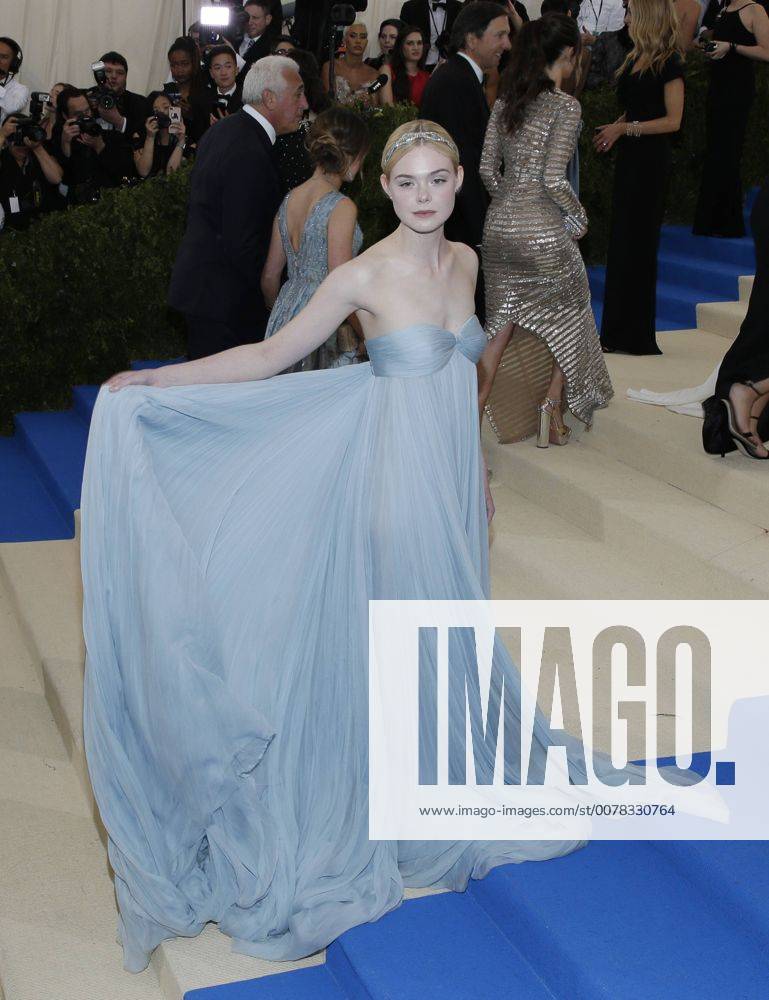 Elle Fanning arrives on the red carpet at the Costume Institute Benefit at The Metropolitan Museum of Art celebrating the opening of Rei Kawakubo Comme des Garcons: Art of the In-Between in New York City on May 1, 2017. NYP20170501594 JOHNxANGELILLO