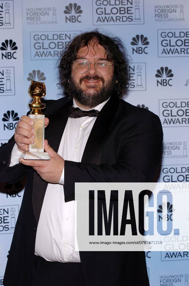 KRT ENTERTAINMENT STORY SLUGGED: GOLDENGLOBES KRT PHOTOGRAPH VIA ABACA PRESS (January 26) Peter Jackson poses with his award in the press room Sunday, January 25, 2004, at the 2004 Golden Globe Awards in Los Angeles, California. (lde) 2004 LOS ANGELES CA USA
