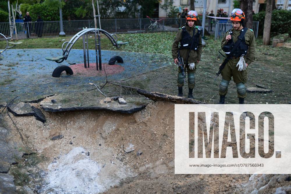 (241222) -- TEL AVIV, Dec. 22, 2024 -- Members of Israeli security forces work at the site of a missile attack launched from Yemen, in Tel Aviv, Israel, Dec. 21, 2024. A missile launched from Yemen early Saturday morning struck a playground and a building in the central Israeli city of Tel Aviv, causing minor injuries to 16 people, according to the Israel Defense Forces (IDF) and the Magen David Adom (MDA) rescue service. Earlier in the day, Yemen s Houthi group claimed responsibility for the attack, which was launched in support of the Palestinians in the Gaza Strip, and in response to the latest Israeli aggression on Yemen, as announced by Houthi military spokesperson Yahya Sarea in a statement, aired by Houthi-run al-Masirah TV. (