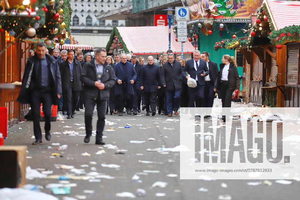 Old Market Attack on Magdeburg Christmas Market Chancellor Olaf Scholz SPD visits the scene of the crime the day after, where a car had crashed into a crowd of people the evening before Among o