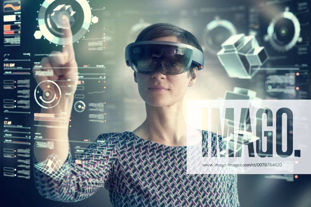 Woman wearing mixed reality smartglasses touching transparent screen model released Symbolfoto property released RBF05667