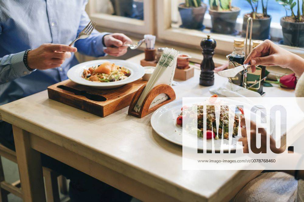 Couple having dinner in a restaurant, partial view model released Symbolfoto property released MOMF00096