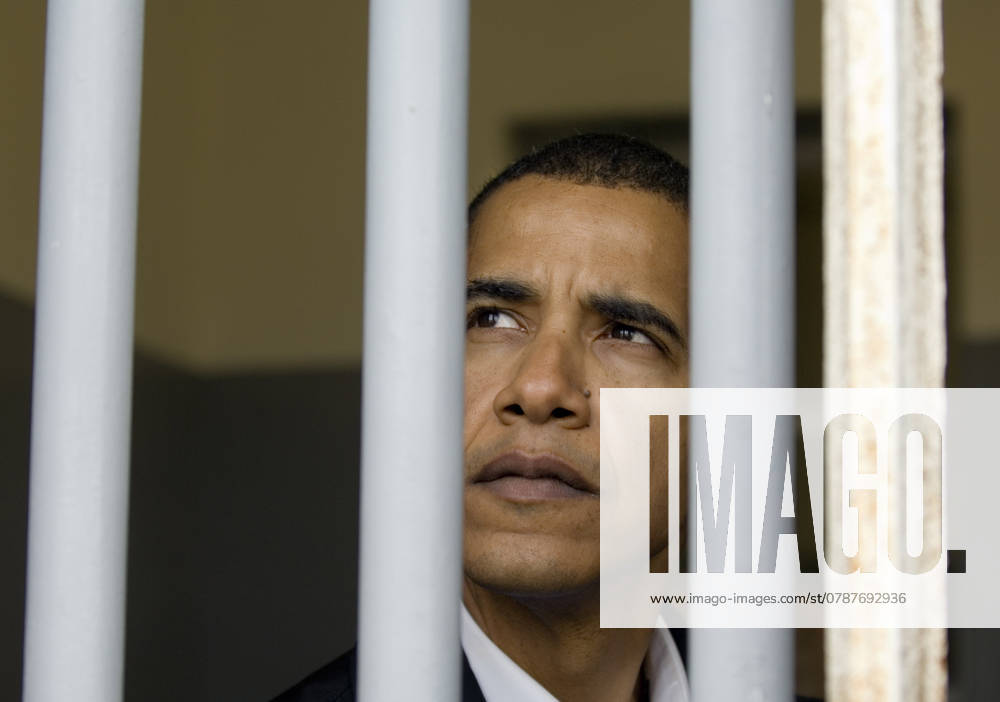 Sen. Barack Obama (D-Ill.) peers out of what was Nelson Mandela s prison cell on Robben Island off the coast of Cape Town, South Africa, Sunday, August 20, 2006. (Pete Souza Chicago Tribune MCT) KEN