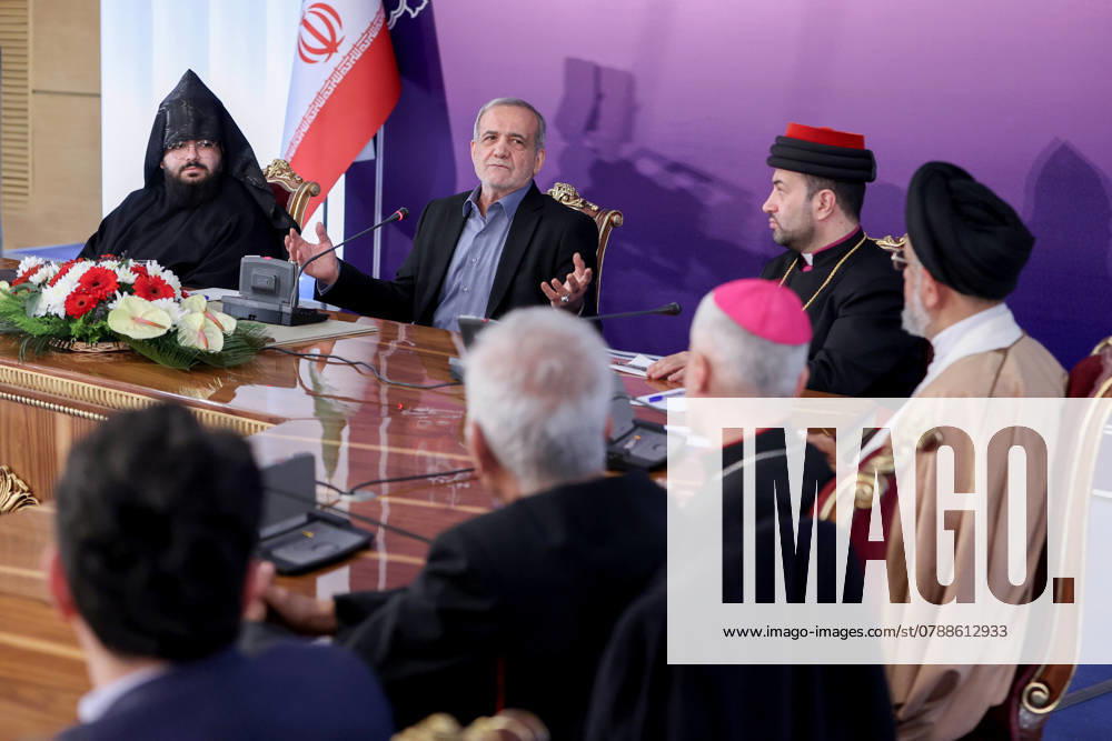 Iranian President MASOUD PEZESHKIAN (C) meets with a group of Christians on Tuesday evening on the eve of the birthday anniversary of Jesus Christ. Tehran Iran - ZUMAi98_ 20241225_zih_i98_004