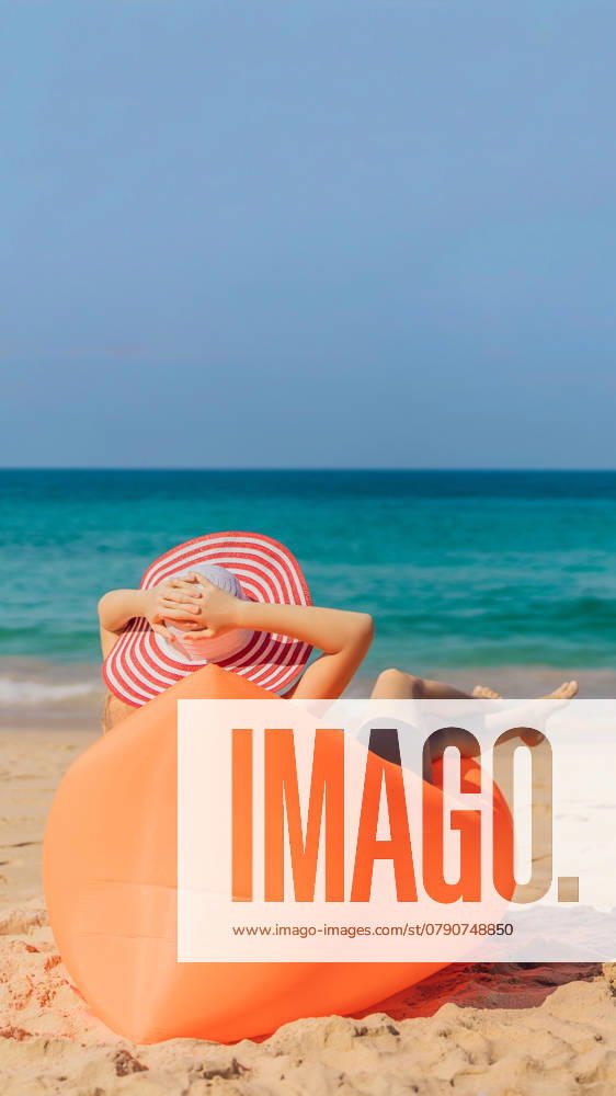 Summer lifestyle portrait of pretty girl sitting on the orange inflatable sofa on the beach of tropical island. Relaxing and enjoying life on air bed. VERTICAL FORMAT for Instagram mobile story or stories size. Mobile wallpaper, model released, , 44414482.jpg, happy, VERTICAL, Instagram, mobile story, Mobile wallpaper, young, girl, inflatable, summer, sunglasses, lamzac, beach, outdoors, leisure, lifestyle, fun, beautiful, fashion, style, hammock, woman, comfortable, sitting, sea, sofa, mattress, relax, people, holiday, model, attractive, sand, ocean, slim, couple, friends, weekend, tan, smiling, cute, fruit, diet, day, eat, man, enjoy, lilo, looking, water, idyllic RECORD DATE NOT STATED