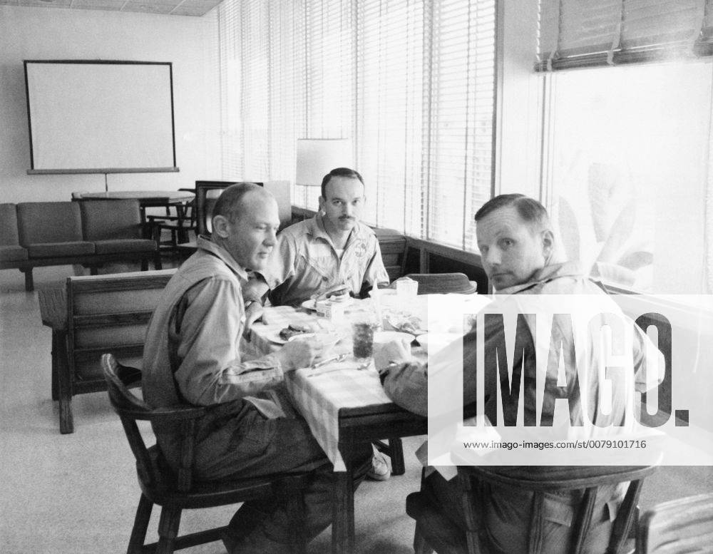 The crew of the Apollo 11 mission is seen dining in the Crew Reception Area of the Lunar Receiving Laboratory after the Apollo 11 mission. Left to right, are Astronauts Buzz Aldrin, Michael Collins, and Neil Armstrong, 1969. Hollywood CA USA 1003_205
