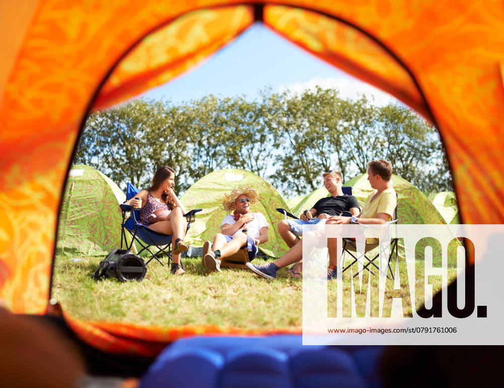 Shot of a group of friends sitting outside their tent at a festival., model released, , 45341336.jpg, standing, woman, summer, social, camp, sit, show, camping, young, unidentifiable, sunshine, sunny, sunlight, sun, socialising, socializing, smiling, audience, recreation, positivity, performance, outside, natural, music festival, men, male, looking, lifestyle, leisure, laugh, informal, hands in pockets, happy, drinking, carefree, group, carnival, candid, campsite, campground, buddy, authentic, alcohol, youth, festival, man, female, people, women, beautiful RECORD DATE NOT STATED