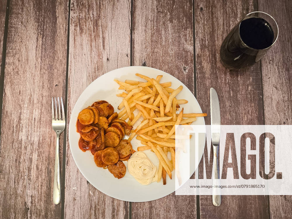 A plate with currywurst and fries with mayo can be seen, next to a glass of cola on January 05, 2025 in Krefeld, Germany Photo by Oliver Kaelke DeFodi Images A plate with currywurst and fries with mayo can be seen, next to a glass of cola on January 5, 2025 in Krefeld, Germany Photo by Oliver Kaelke DeFodi Images Defodi 678 678 2025 01 05 STOCK 0007 Defodi-678
