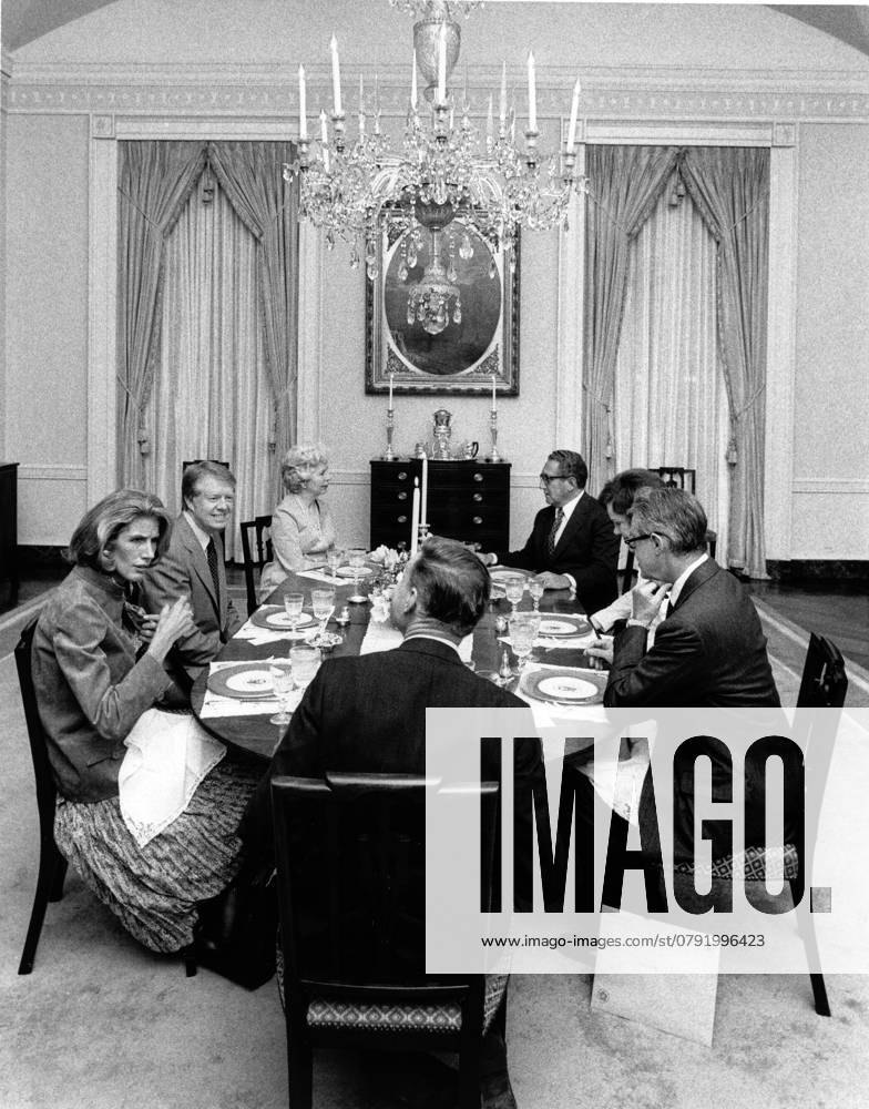 Former President Jimmy Catrter Dead at 100 ARCHIVE: At dinner in the first floor dining room of the White House in Washington, DC, from left to right: Mrs. Nancy Kissinger, United States President Jimmy Carter, Mrs. Grace S. Vance, former US Secretary of State Dr. Henry A. Kissinger, first lady Rosalynn Carter, US Secretary of State Cyrus R. Vance and National Security Advisor Dr. Zbigniew K. Brzezinski on March 18, 1977. Credit: White House via CNP AdMedia Washington District of Columbia United States of America