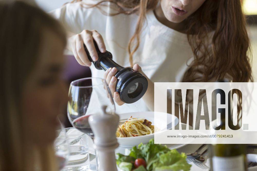 Friends eating together spaghetti carbonara model released Symbolfoto property released ZOCF00364