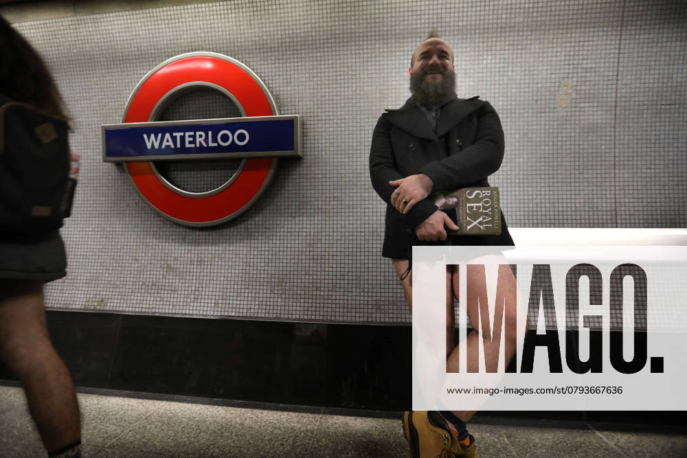 A traveller with a book waits on the platform for a train at Waterloo. Those participating in this annual event do for no reason other than to have fun. They gather, go onto the London Underground system, remove their trousers and ride around the system for a bit. The tradition started in New York in 2002, the whole point is to remain as nonchalant as possible despite the fact that participants have no trousers on. London United Kingdom - ZUMAmp3_ 20250112_zip_mp3_021