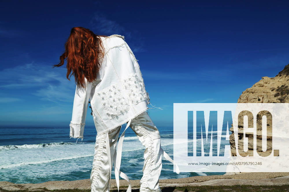 This handout image shows model Annie wearing: White denim jacket ($45,100) and silk cargo pants ($31,000) by Balenciaga in San Francisco on February 24, 2016. stylist and photographer OLIVIA TSANG makeup and hair JANET MARISCAL model ANNIE (Scout Models). 24FEB16 FASHION POST MAGAZINE San Francisco - United States