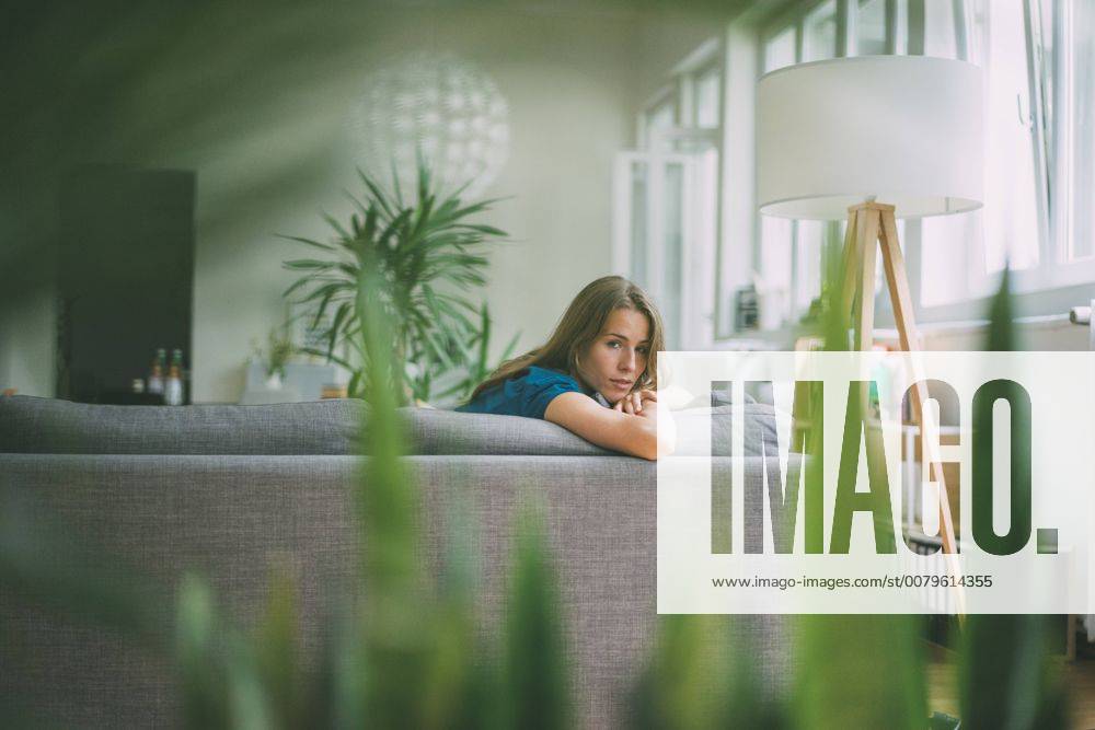 Portrait of young woman relaxing at home model released Symbolfoto property released KNSF01674