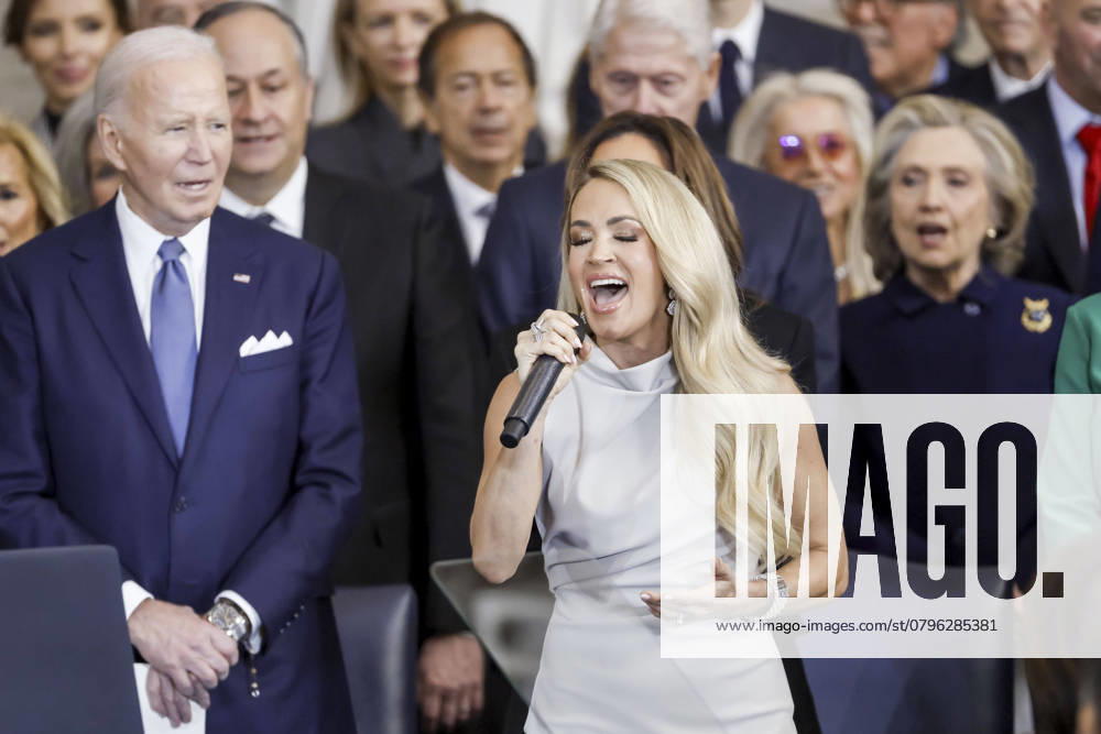 Country singerÃ‚ Carrie Underwood (C) performs Ã¢â‚¬ËœAmerica the BeautifulÃ¢â‚¬â ¢ as former US President Joe Biden (L) looks on during US President Donald TrumpÃ¢â‚¬â ¢s inauguration ceremony in the rotunda of the United States Capitol in Washington, DC, USA, 20 January 2025. TrumpÃ¢â‚¬â ¢s planned outdoor inauguration ceremonies and events are being held inside today due to a forecast of extreme cold temperatures. Washington USA - ZUMAs152 20250120_faa_s152_1124