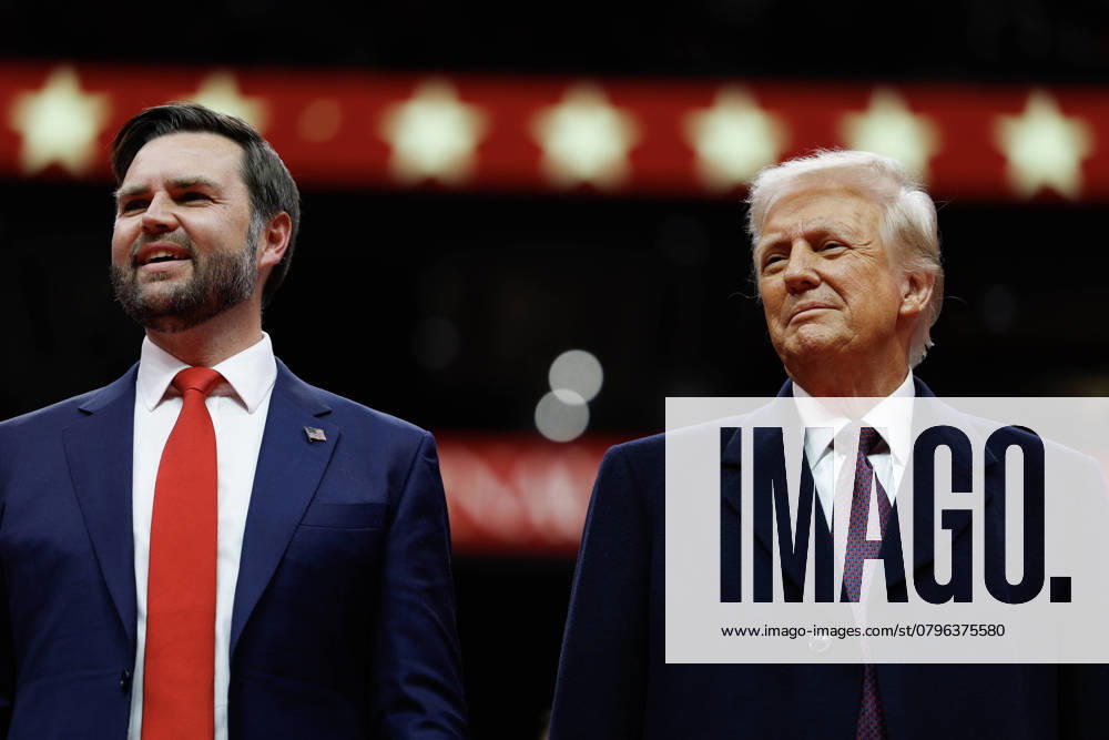 WASHINGTON, DC - JANUARY 20: U.S. Vice President J.D. Vance and U.S. President Donald Trump watch during an indoor inauguration parade at the Capital One Arena on January 20, 2025 in Washington, DC. Donald Trump takes office for his second term as the 47th president of the United States.